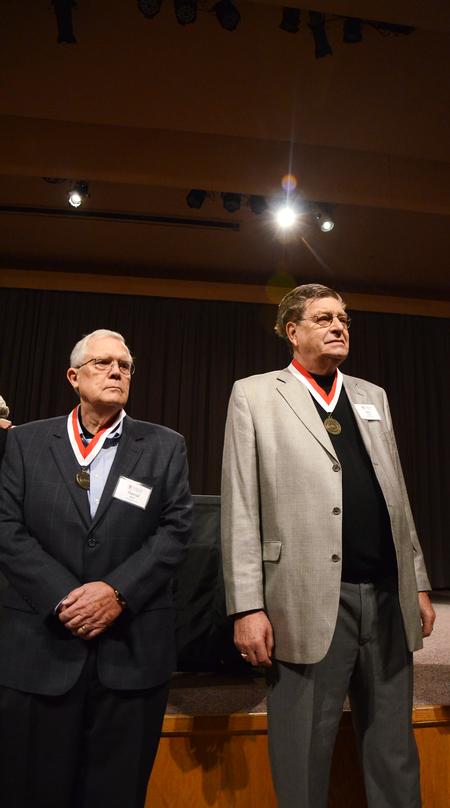 Otis Griffin and David Miller, members of the Class of 1962, stand in front of students while being recognized in the Homecoming Reunion Chapel. - Photo by Zac Calvert