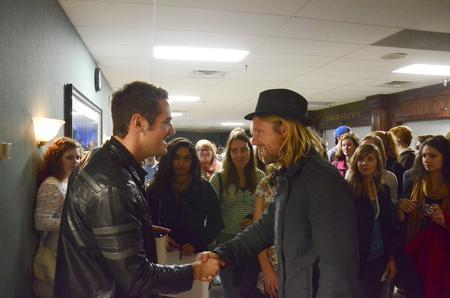 Jon Foreman greets Justin McEachron, senior English major, after the Homecoming Concert in the G.M. Savage Memorial Chapel. - Photo by Zac Calvert