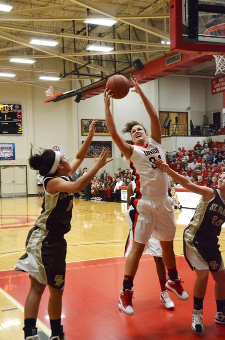Shelby Ashcraft rebounds the ball against St. Francis during the Homecoming game. - Photo by Zac Calvert