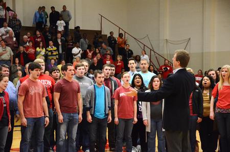 Choral Union, including alumni, perform the Star Spangled Banner during the Lady Bulldog homecoming game against St. Francis. - Photo by Zac Calvert