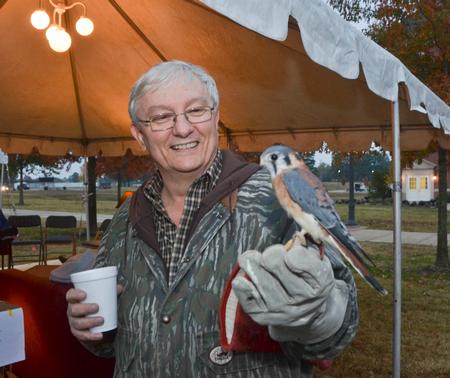 James Huggins, university professor of biology, shows off a falcon at Union Night, a part of the homecoming festivities. - Photo by Morris Abernathy