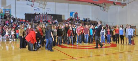 Union University Choral Reunion, including alumni, perform the Star Spangled Banner before the Union University women's basketball game.
 - Photo by Morris Abernathy