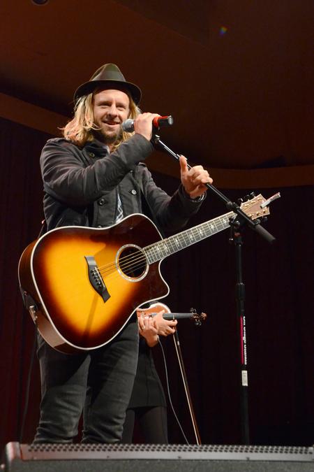 Jon Foreman, musician and lead vocalist of Switchfoot, talks to the crowd during the Homecoming Concert in the G.M. Savage Memorial Chapel. - Photo by Jacob Moore