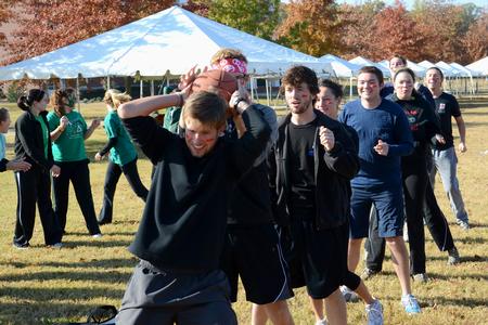 Teams made of different student groups around campus compete in a relay race during Homecoming Olympics.
 - Photo by Jacob Moore
