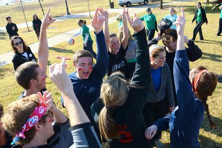 Students cheer after winning a relay race during Homecoming Olympics. - Photo by Jacob Moore