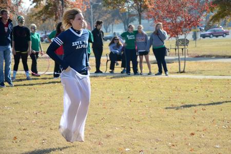 Chelsea Monroe, sophomore broadcast journalism major, competes in a sack race during Homecoming Olympics.
 - Photo by Jacob Moore