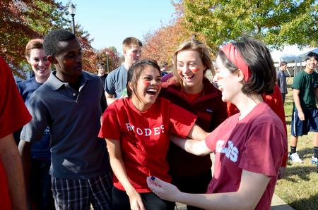 Josselyne Bustillo (center), freshman political science major, celebrates a win with her teammates during Homecoming Olympics. - Photo by Jacob Moore