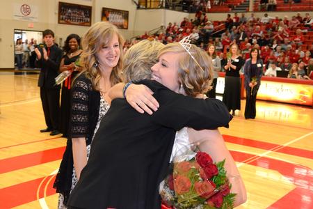 Andi Schreiber, senior family studies major, hugs Lanese Dockery, first lady of the university, after being crowned as the 2011 Homecoming Queen.
 - Photo by Jacob Moore