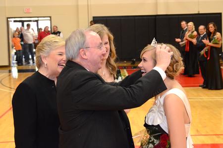David Dockery, president of the university, crowns Andi Schreiber, senior family studies major, as the 2011 Homecoming Queen. - Photo by Jacob Moore