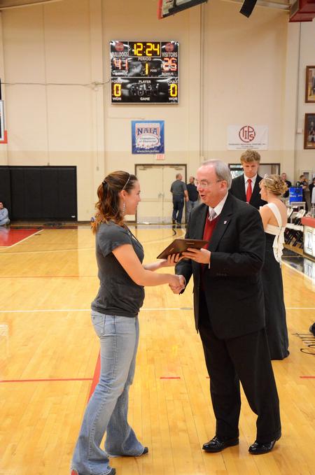 David S. Dockery, president of the university, presents the Champions for Change award to Natalie Schlar, junior social work major and president of Union's International Justice Mission chapter. - Photo by Zac Calvert