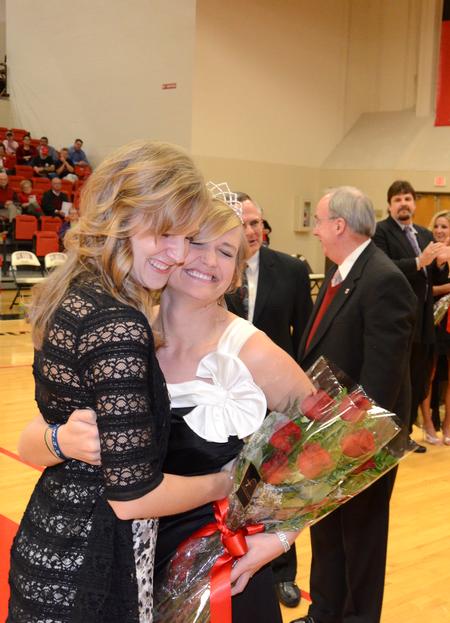 Union alum and 2010 Homecoming Queen Emily Logan embraces 2011 Homecoming Queen Andi Schreiber, senior family studies major. - Photo by Jacob Moore