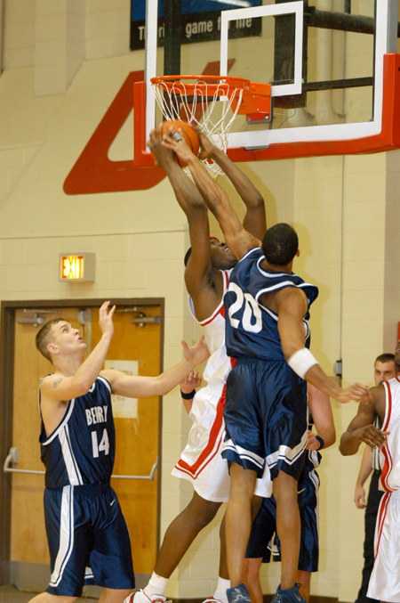 Freshman center Pierry Valmeria (44) has his shot contested by a Berry College defender. - Photo by Kristen Hiller