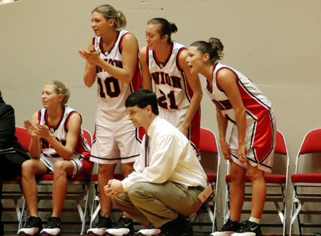 Union's head coach Mark Campbell and other Lady Bullodgs watch the final minutes of a Union win in the NAIA National Tournament. - Photo by Kristen Nicole Sayres