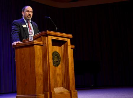Scott Huelin, director of the honors community and associate professor of English, speaks in chapel. - Photo by Ebbie Davis