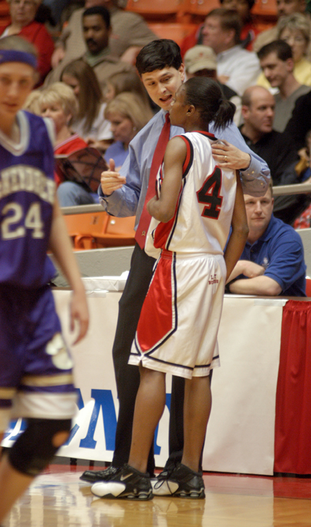 Union's head coach Mark Campbell talks with sophomore guard, Latorya Fuller (4) in the first round of the 2004 NAIA National Tournament. - Photo by Kristen Nicole Sayres