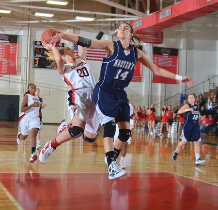 Union's Amy Philamlee brings the ball deep into the paint  during game two of the Rotary Classic. - Photo by Morris Abernathy