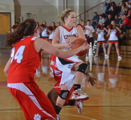 Union Lady Bulldog Amy Philamlee drives in  strong to the hoop. - Photo by Morris Abernathy