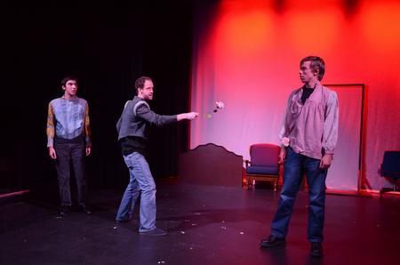 Chad Hoy, senior theatre/speech major, prepares to duel Matthew Cole, senior digital media studies major, during a scene for Lori Landon's one-act called 'The Least Offensive Play in the Whole Darn World.' - Photo by Jacob Moore