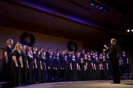 David Dennis, professor of music, leads the choir in a song during "A Union Christmas," an annual performance by the music department. - Photo by Ebbie Davis
