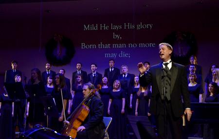 Chris Mathews, associate professor of music and department chair, leads the music department in Hark the Harold Angels Sing during "A Union Christmas." - Photo by Ebbie Davis
