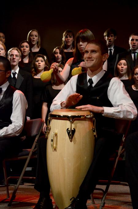 Logan Brasher, sophomore music major, drums for the music department's annual performance of "A Union Christmas." - Photo by Ebbie Davis