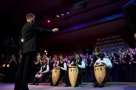 Chris Mathews, associate professor of music and department chair, leads the music ensembles in Christmas music for "A Union Christmas." - Photo by Ebbie Davis
