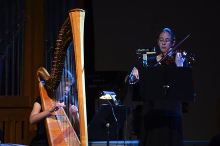  The Union music department presents their annual 'A Union Christmas' performance in the Savage Chapel, Dec. 6.  Paige Tang, violin and Vicki Searl, harp preform "Ave Maria". - Photo by Morris Abernathy