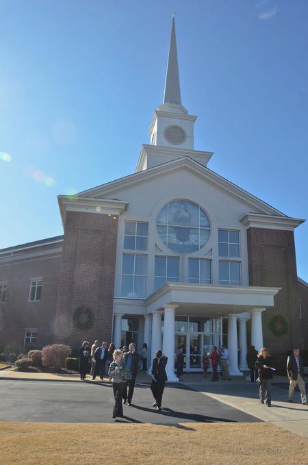Friends and family leave at the  conclusion of the Commencement Service at West Jackson Baptist Church. - Photo by Morris Abernathy