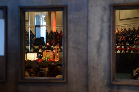 With the church full, many people peeked through the back doors to see their friends and loved ones graduate at the 2011 Fall Commencement Services. - Photo by Ebbie Davis
