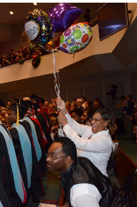 Family and friends cheer for graduates during the 2011 Fall Commencement Services. - Photo by Jacob Moore