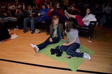 Rebekah Kindt, junior elementary education major, and Rebecca Thomas, junior elementary education/TESL major, chat while waiting for the Movie in the Bowld, sponsored by SAC. - Photo by Anne Richoux
