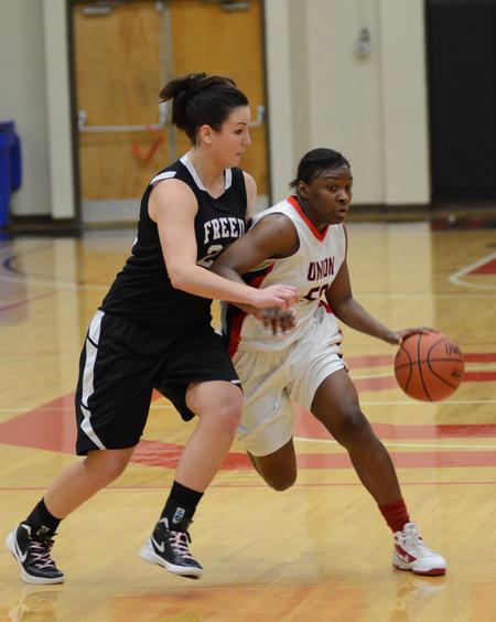 Photo by Jacob Moore
Lady Bulldog Lavanda Ross drives against Freed Hardeman's Grace Alonso de Armino during a game Feb. 11 at the Fred DeLay Gymnasium. - Photo by Jacob Moore