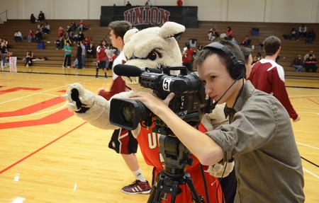 Buster the Bulldog helps Devin Hall, freshman theatre/speech major, count down a broadcast during Union Nation Spirit Night. - Photo by Jacob Moore