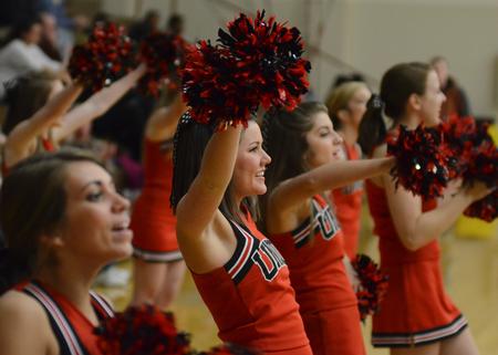 Photo by Jacob Moore
Cheerleader Megan Mysinger entertains the crowd during a basketball game against Cumberland University Feb. 13 at the Fred DeLay Gymnasium. - Photo by Jacob Moore