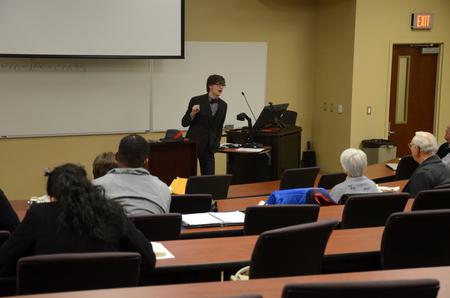 Students, employees, and community members listen as Greg Thornbury, dean of the school of theology and missions and vice president for spiritual life, speaks at the Town & Gown: Media, Politics, & Democracy lecture series.  - Photo by Anne Richoux