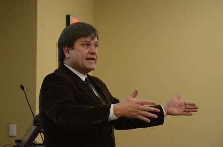 Gene Fant, vice president for academic administration and dean of the school of arts and sciences, lectures on "Citizen Journalism: A Historic Tradition Meets Modern Technology" at  the Town & Gown lecture series. - Photo by Anne Richoux