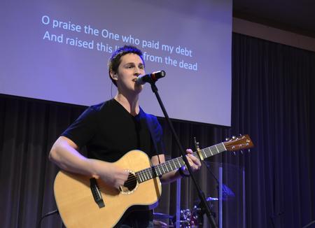 Brett Perkins, senior Christian studies major, leads chapel music. - Photo by Jacob Moore