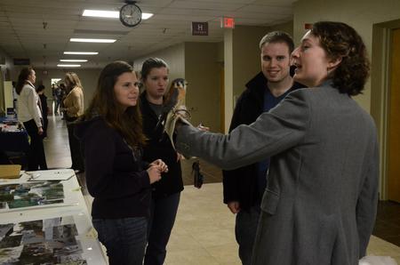 Sarah Porter, Sam Howard, and Jonathan Rogers talk with Jennifer Gruenke, associate professor of biology, during the external study fair. - Photo by Anne Richoux