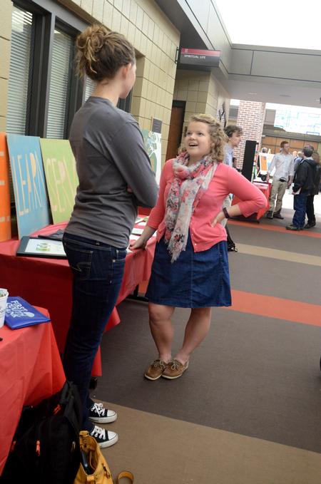 Hannah Mahoney and Rachel Skaret, junior nursing majors, chat during the student organization fair in the Student Union Building.  - Photo by Anne Richoux