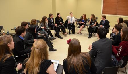 Scholars of Excellence participants play a game of Catchphrase during a break between interviews. - Photo by Jacob Moore