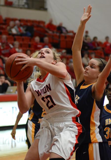Amy Philamlee goes up for a shot against Lady Topper Chelsea Hussey of Blue Mountain College. - Photo by Jacob Moore