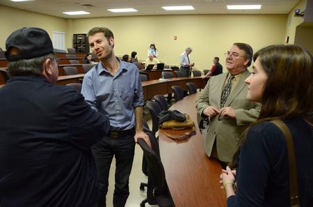 Garrett Hubbard, visual journalist for <em>USA TODAY</em>, greets Troy Martin after speaking at the Town & Gown lecture series while Michael Chute, director for the Center for Media, Faith, and Culture, and Brittney Julian, sophomore psychology major look on. - Photo by Jacob Moore