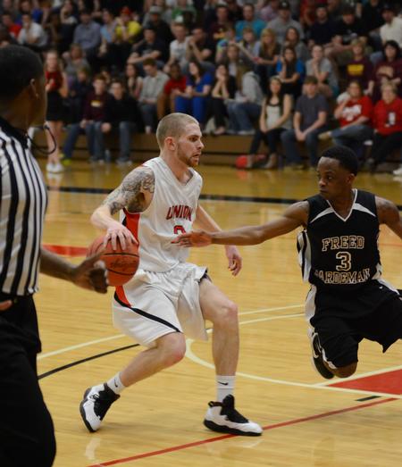 David Lane drives down the court during the opening round of the TranSouth Athletic Conference Championship against Freed Hardeman University. - Photo by Jacob Moore