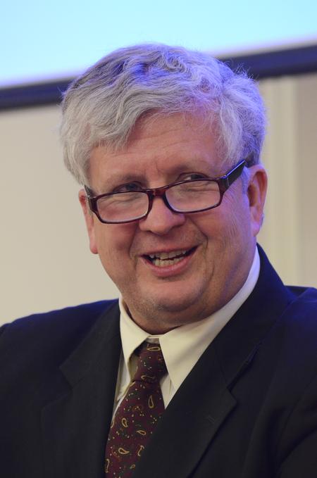 Tom Cooper, author of <em>Fast Media/Media Fast</em> and professor of visual and media arts at Emerson College, speaks about the need for a healthy intake of mass media in the world today during the Town & Gown lecture series. - Photo by Zac Calvert