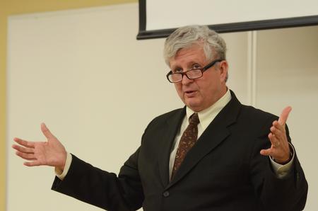 Tom Cooper, author of <em>Fast Media/Media Fast</em> and professor of visual and media arts at Emerson College, speaks about the need for a balanced media life, telling guests about the dangers of being too immersed in mass media. - Photo by Zac Calvert