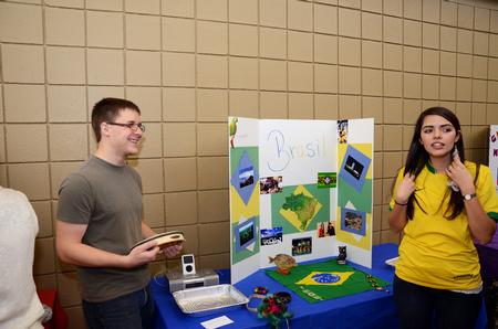 Curtis Schulz, junior applied linguistics major, and Nadja Barros, junior nursing major, show their Brazil display to Union students and employees during CultureFEST. - Photo by Zac Calvert