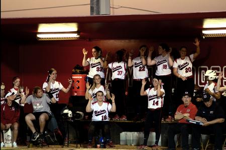 The Lady Bulldog softball team cheers from the dugout during a double-header against Freed-Hardeman University. The Lady Bulldogs won both games 2-0.  - Photo by Anne Richoux