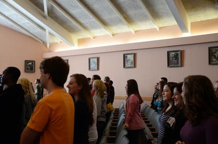 Students attend chapel surrounded by donated paintings of the gospel story. - Photo by Ebbie Davis