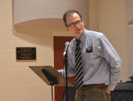 Dr. Bobby Rogers introduces  Pulitzer Prize-winning poet Carl Dennis . - Photo by Morris Abernathy