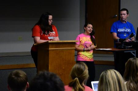 Jamie Blurton (middle), junior social work major, tells students about a new organization during Student Senate. - Photo by Anne Richoux